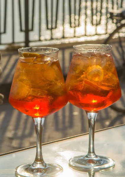 Waiter prepared the Aperol Sprits summer cocktail with Aperol, p