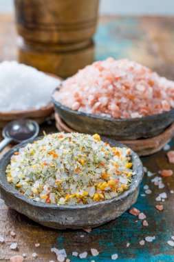Gross sea salt mixed with dried red hot chili pepper, colorful seasoning close-up clipart