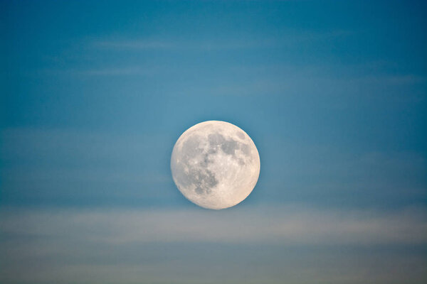 Big full Moon in the blue sky, background or wallpaper