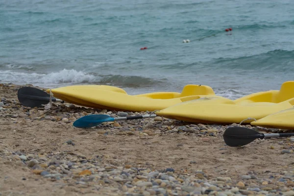Water sport equipment - kayak on the beach, vacation leisure
