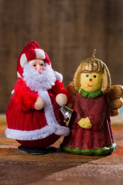 Christmas decoration, colorful angel girl candlelight and Santa Claus — Stock Photo, Image