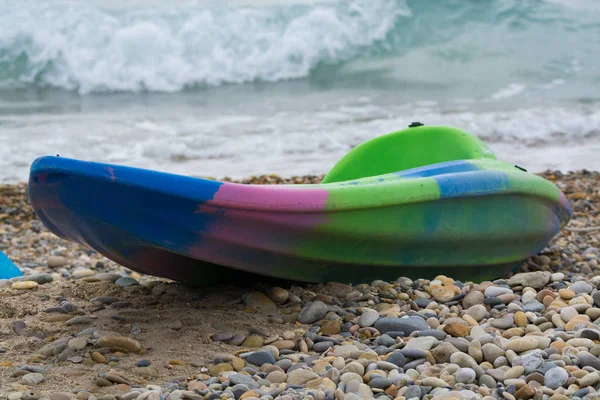 Water sport equipment - kayak on the beach, nobody