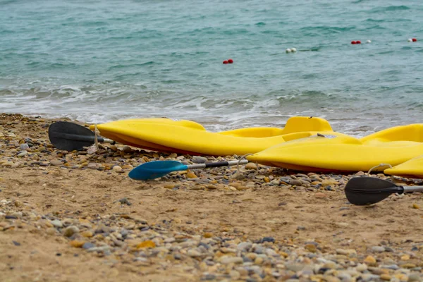 Water sport equipment - kayak on the beach, vacation leisure