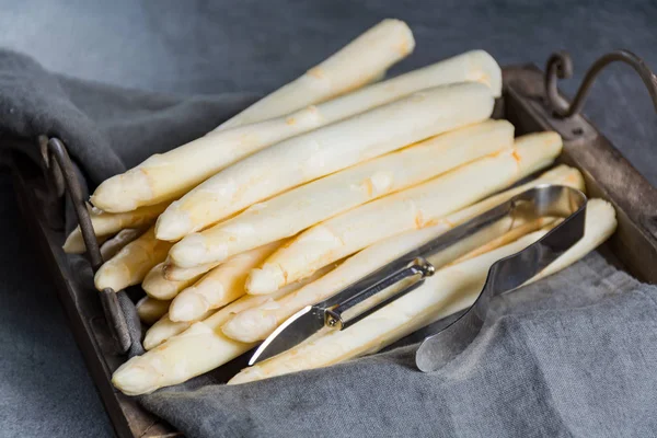 Spring season, new harvest of Dutch, German white asparagus, bunch of raw white asparagus