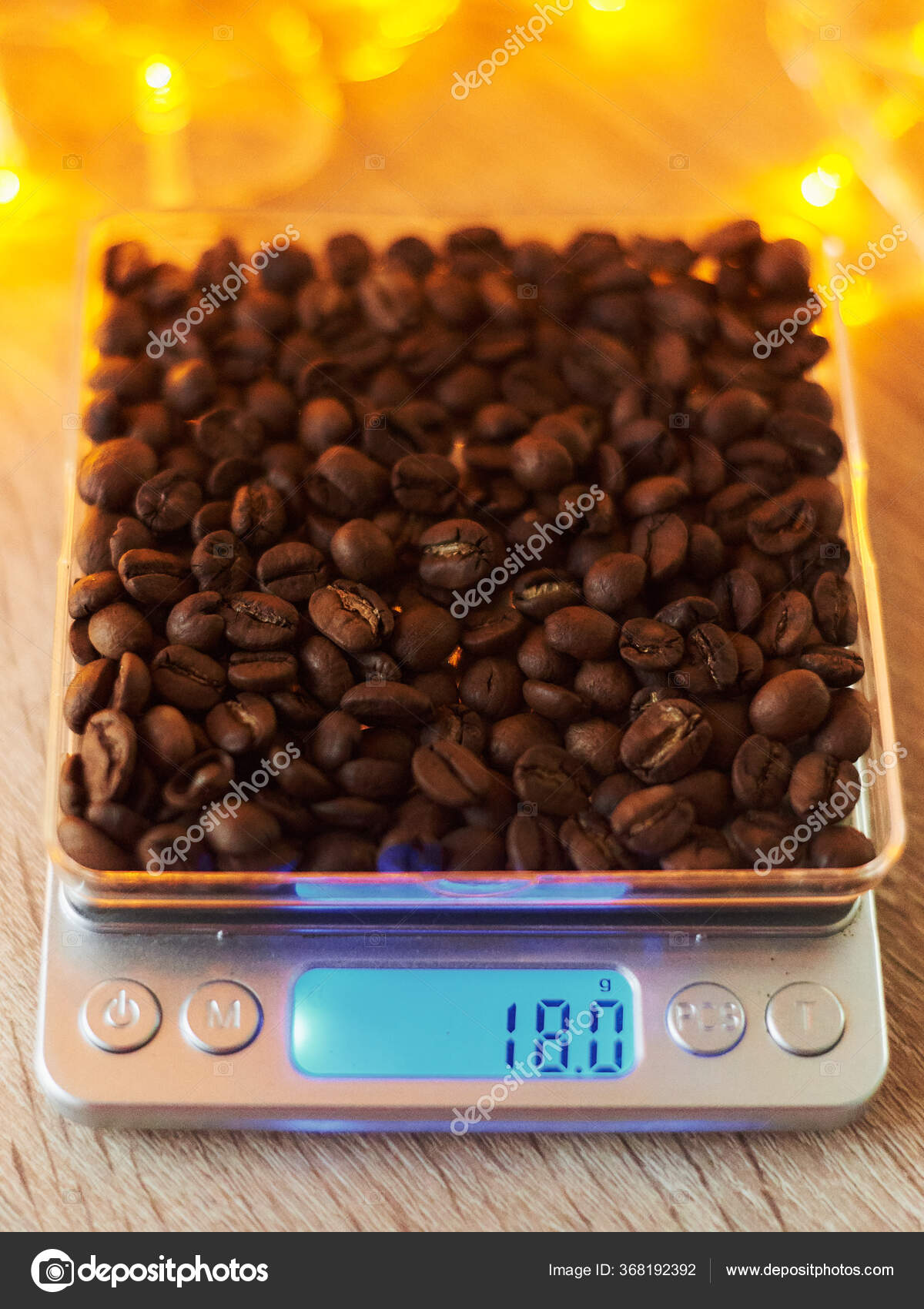 https://st3.depositphotos.com/6817322/36819/i/1600/depositphotos_368192392-stock-photo-eighteen-grams-roasted-coffee-beans.jpg