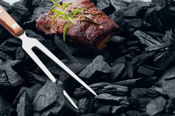 Beef steak on the charcoal with meat fork.product photo, place for your advertisment — Φωτογραφία Αρχείου