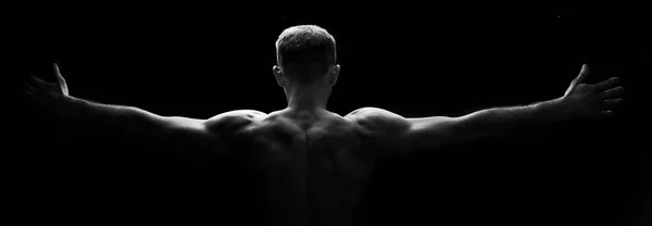 Necj muscular e costas do homem. Mostrando músculo .Low key.Black e foto branca — Fotografia de Stock