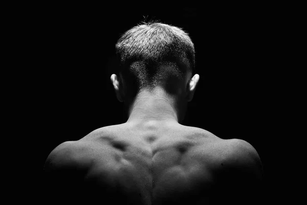 Muscle necj and back of man . Showing muscle .Low key.Black and white photo