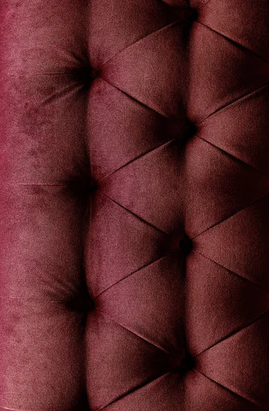 Bordo red cloth sofa texture background.Concept Textures of furniture