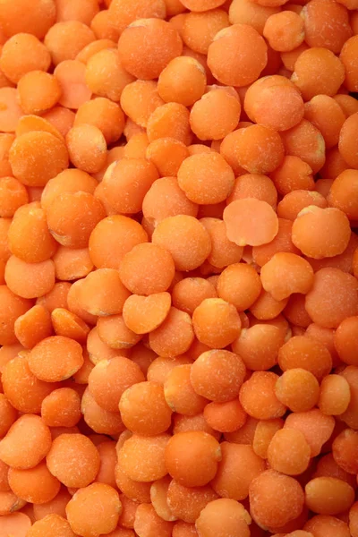 Orange lentils close-up .Texture .Selective focus.Red lentils — стоковое фото