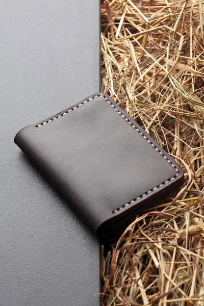 Brown card holder. Hand made leather man card holder. Multi colored. Leather craft.On creative background .Top view