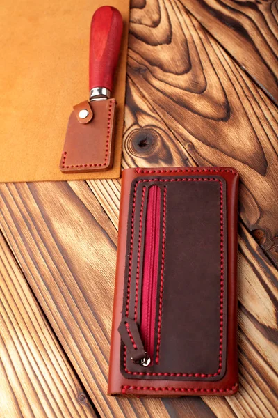 Brown leather wallet.Genuine leather craft object with tool using for wallet.DIY tools.Hand crafted wallet