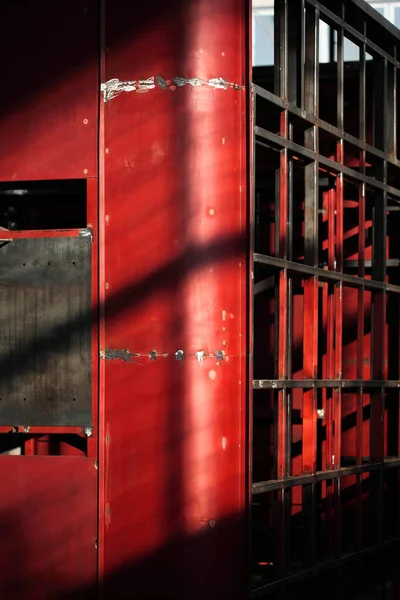 abstract red metal construction welded together. Geometric metal construction.Welded metal texture.light and shadow