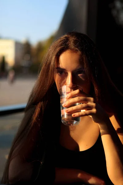 Dramatic portrait of girl drink glass of water. — Stock Photo, Image