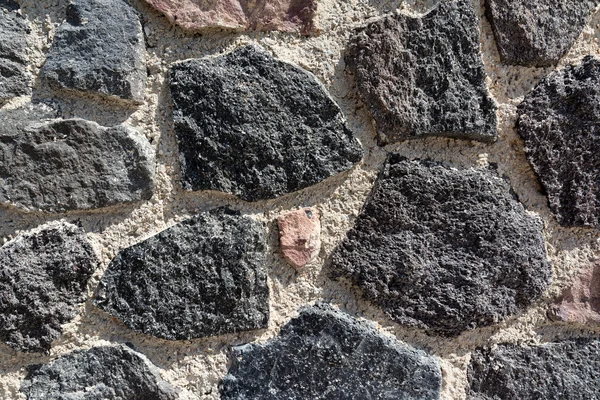 Fechar a parede de pedra vulcânica em Santorini, Grécia — Fotografia de Stock
