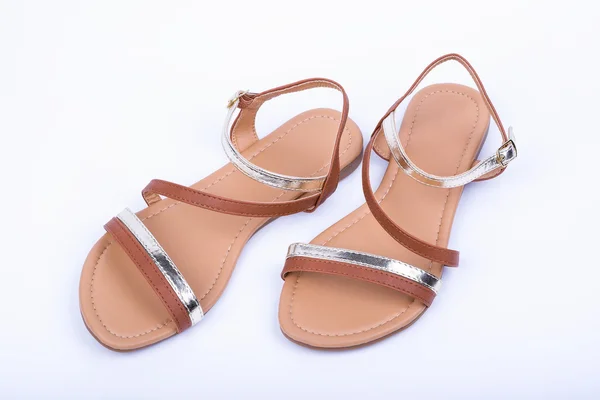 Women's brown sandals on white background. top view — Φωτογραφία Αρχείου