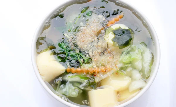 stock image Thai style Seaweed soup with Bean Curd , mixed vegetable, Tofu  in white bowl on white background. Vegetarian Food, Healthy food, Thai food