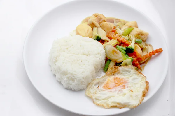 Stir Fried Tofu in Chinese Style,Deep Fried Tofu with Gravy Sauce ,Stir fried tofu with mixed vegetables in white plate on white background. Vegetarian Food, healthy food.