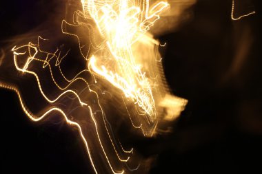 yavaş hızı ile hareket ışık çekim, sokak ışıkları gece zamanında hız arabada. ışık arka plan.