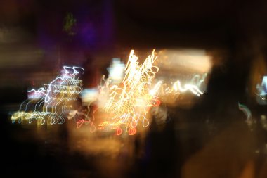 yavaş hızı ile hareket ışık çekim, sokak ışıkları gece zamanında hız arabada. ışık arka plan.