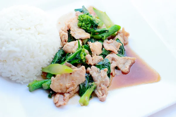 stock image Stir-Fried Broccoli with pork with rice in white dish on white background, Thai Food.