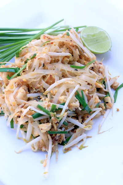 Pad Thai, stir-fried rice noodles with shrimp in white dish isolated on white background. The one of Thailand's national main dish. the popular food. Thai Fried Noodles — Stock Photo, Image