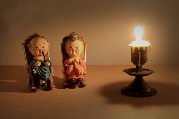 Grandma and grandpa dolls in chinese uniform style standing on wooden background. in chinese new year — Stock Photo, Image