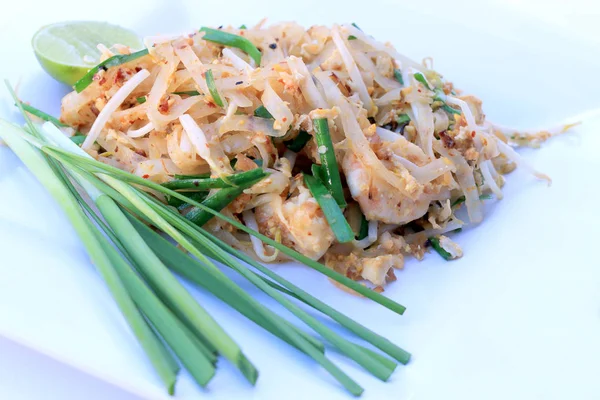 Pad Thai, stir-fried rice noodles with shrimp in white dish isolated on white background. The one of Thailand's national main dish. the popular food. Thai Fried Noodles — Stock Photo, Image