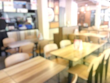 Modern konferans salonu ya da seminer odası masa ve sandalye toplantıdan önce arka plan bulanık görüntü. Konferans salonu ya da salonu veya sınıf boş koltuk sırasının bulanıklık. Vintage rengi.