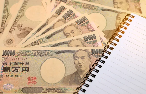 10000 Nota Yen Japonês Com Moeda Iene Japonês Com Notebook — Fotografia de Stock