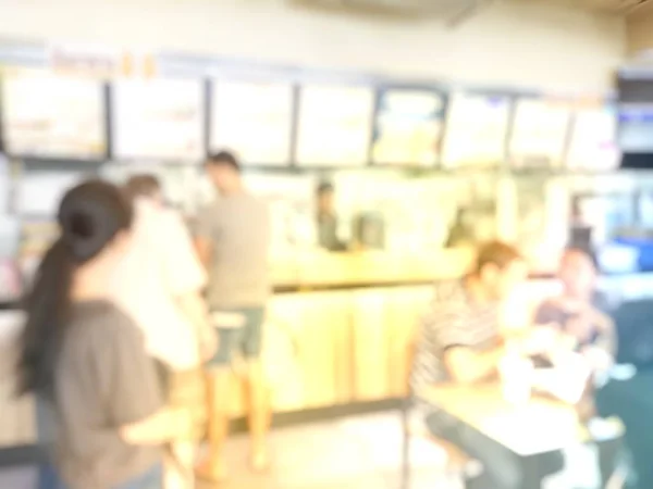 Blurred background of people in cafe