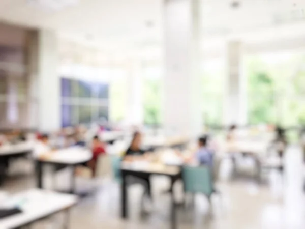 Education concept, Abstract blurred background image of students and business people  studying and discuss in large hall profession seminar with screen and projector for showing information.