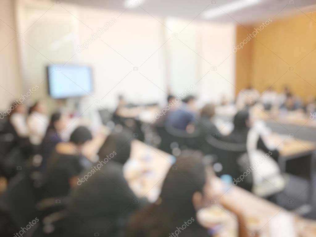 Education or Business concept of blurred image of people brandstorming and discussion during workshop and seminar in training room at university.