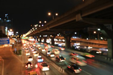 Soyut dairesel Bokeh hareket lensleri şehir ve sokak lambası veya gece vakti Bokeh ışığı. Bangkok Otoyolu Tayland.