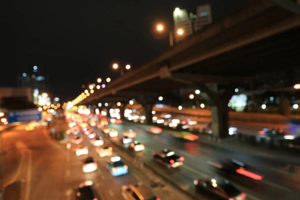 Abstract circular bokeh motion lens blur backround of city and street light or Bokeh light from car in street in night time. Bangkok Expressway Thailand. — Stock Photo, Image