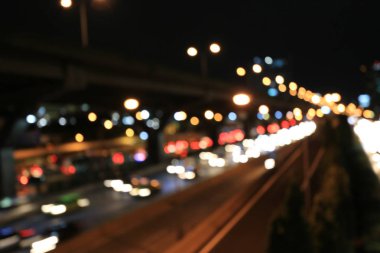 Soyut dairesel Bokeh hareket lensleri şehir ve sokak lambası veya gece vakti Bokeh ışığı. Bangkok Otoyolu Tayland.
