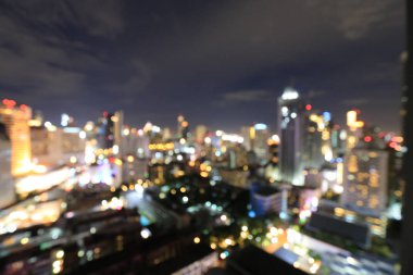 Bulanık iş şehir merkezi ışık şehir merkezinde kentsel gece ışık bokeh ile gece bina ofisinden gelen arka plan arka plan defocused. Cityscape, twilight saat.