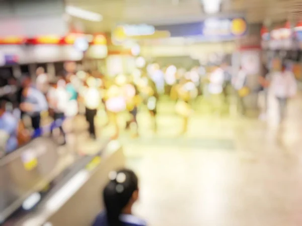 Blurred people in railway station waiting for train. Travel concept