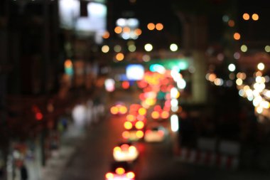 Soyut dairesel Bokeh hareket lensleri şehir ve sokak lambası veya gece vakti Bokeh ışığı. Bangkok Otoyolu Tayland.