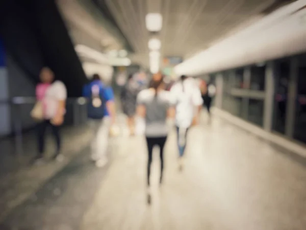 Blurred busy people in airport hall