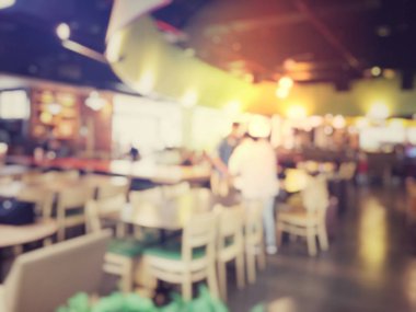 Fast food kavramı. İnsanlar yeme blurred. Vintage rengi.