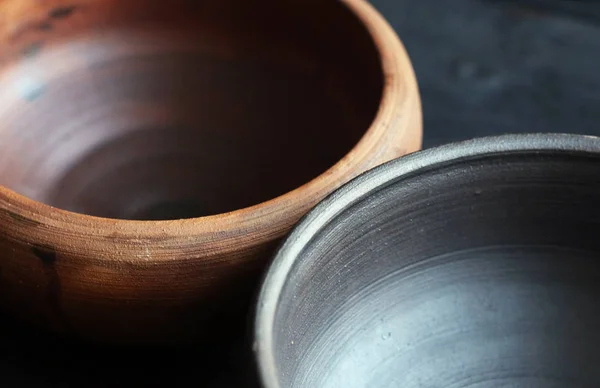 Ceramic bowls on wooden background — Stock Photo, Image