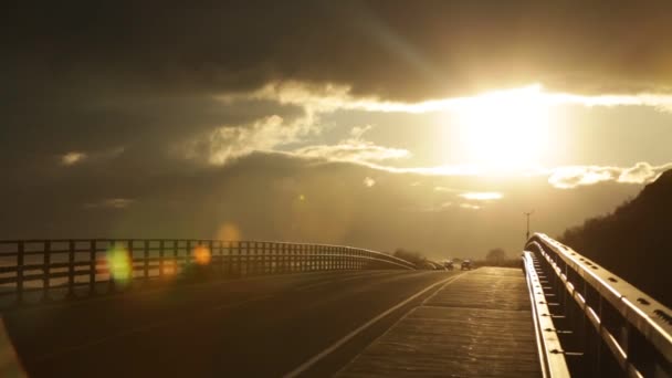 Cars moving on bridge at sunset — Stock Video