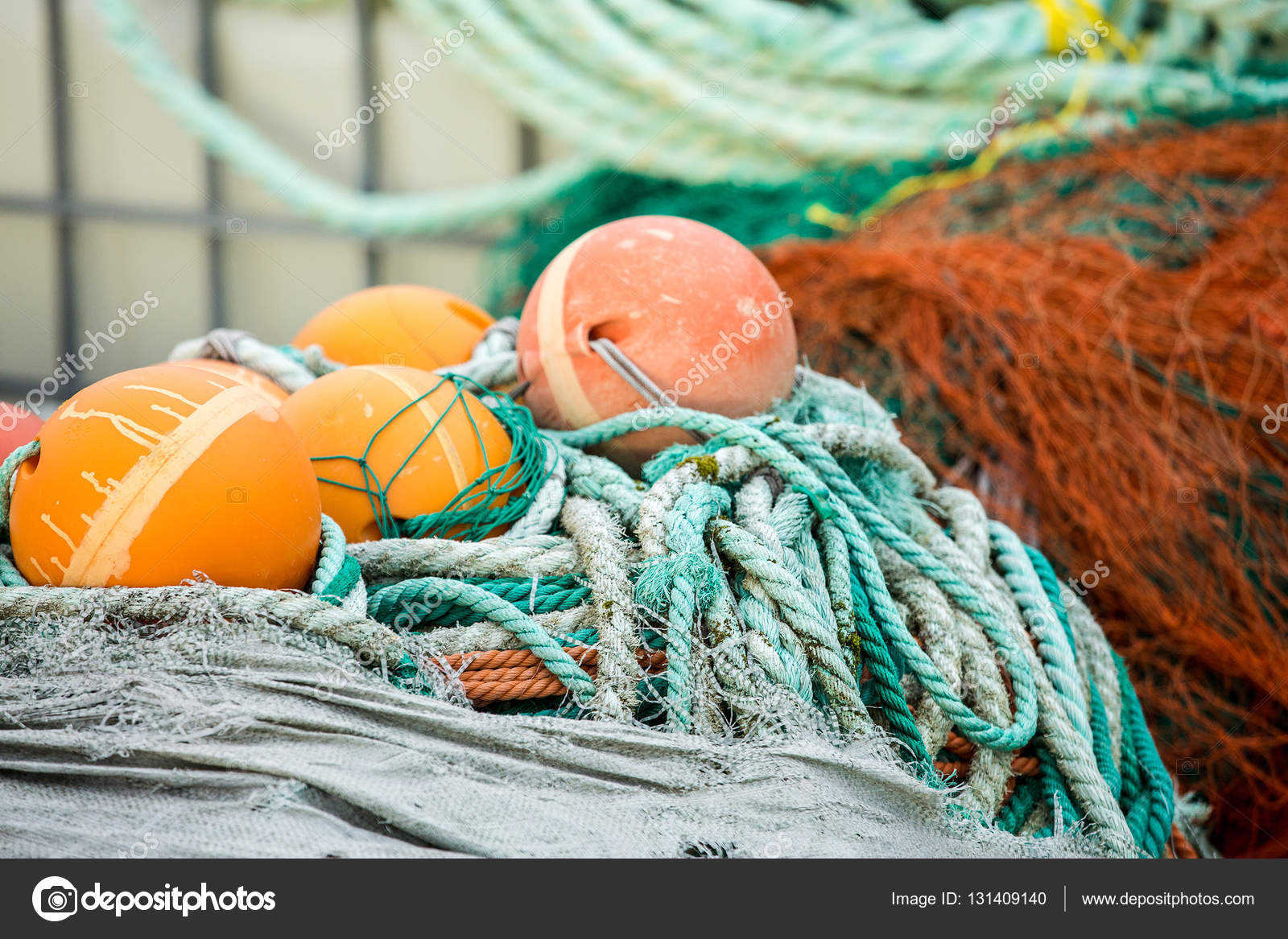 Fishing nets and floats on wooden dock — Stock Photo © Scharfsinn