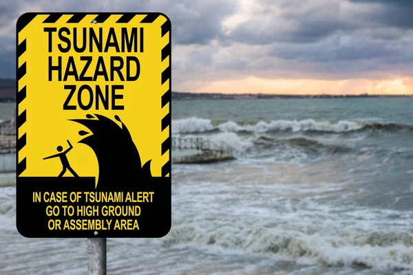 Sign warning of a tsunami — Stock Photo, Image