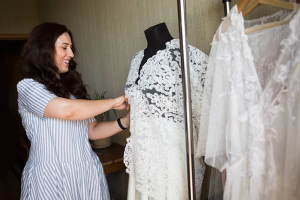 Dress designer making lace wedding dresses. — Stock Photo, Image