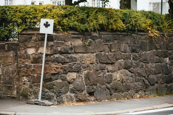 Sign of falling leaves on street — Stock Image Sign of falling leaves on street Stock Photo