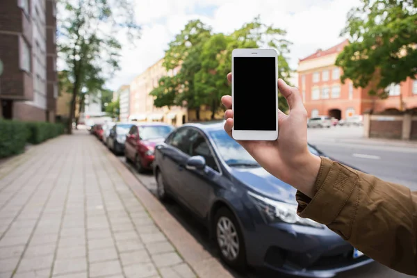 Hand med telefon — Stockfoto