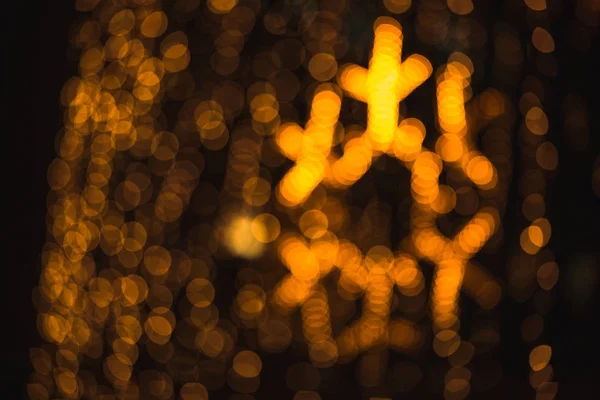 Verschwommener Hintergrund orangefarbener Weihnachtsbeleuchtung — Stockfoto