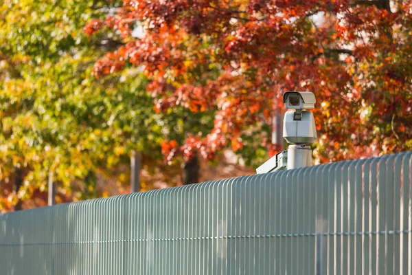Surveillance camera with motion sensor.